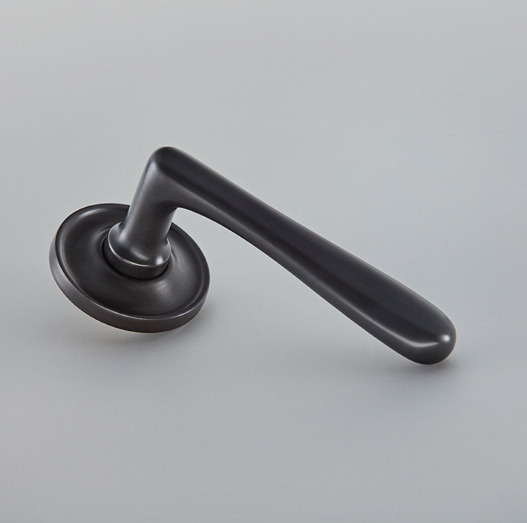 Elegance Door Lever on Raised Edge Covered Rose