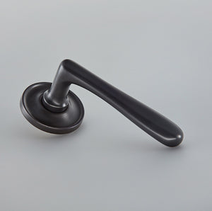 Elegance Door Lever on Raised Edge Covered Rose