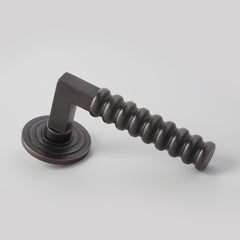 Rutland Door Lever on Double Step Round Rose