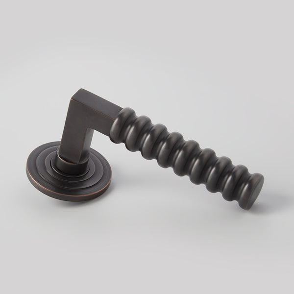 Rutland Door Lever on Double Step Round Rose